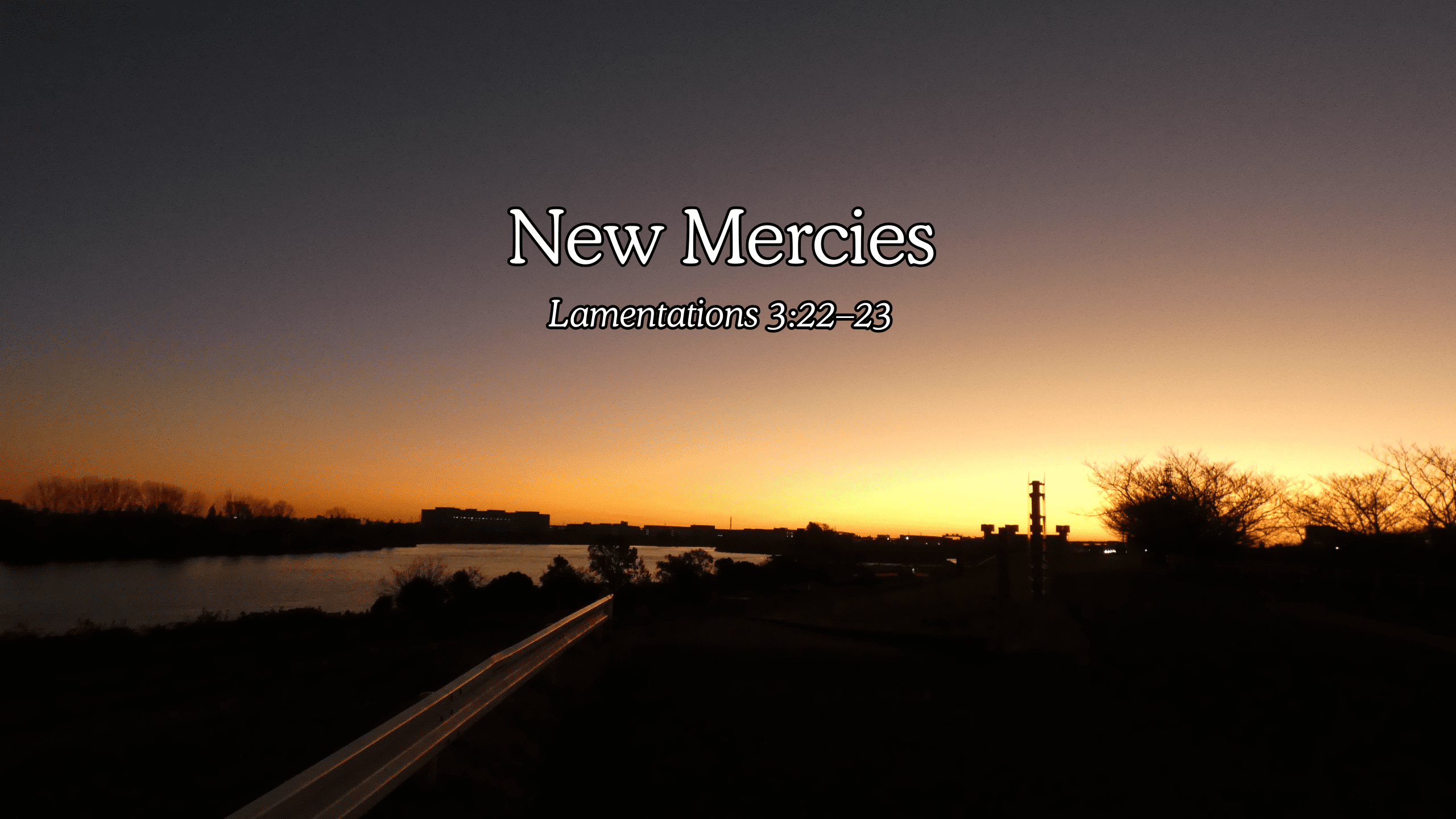 Sunrise over Arakawa in Tokyo, yellow glow in dark sky.